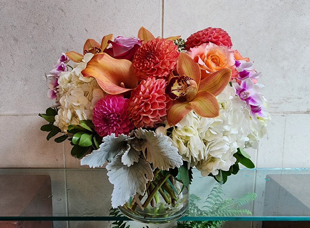 Big and Bold Vase Arrangement with colorful seasonal flowers in a clear glass vase.