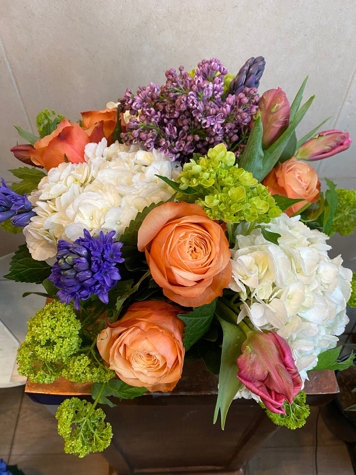 Big and Bold Vase Arrangement with colorful seasonal flowers in a clear glass vase.